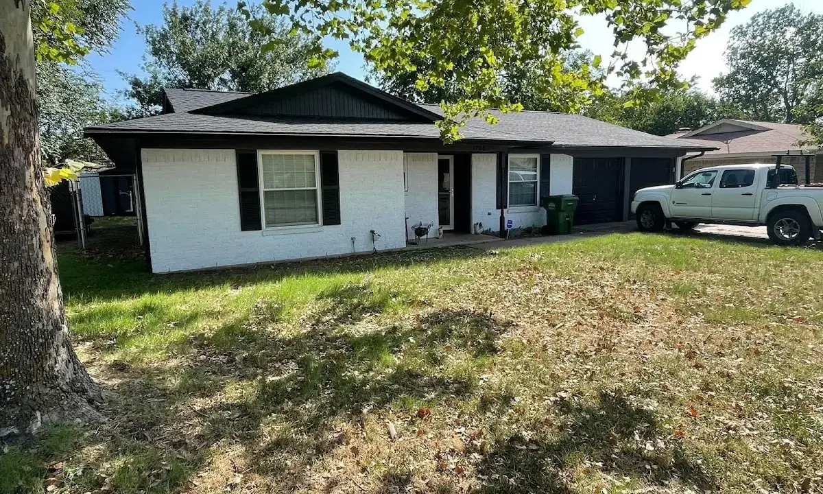 Professional roofing crew working on a residential roof in Brentwood